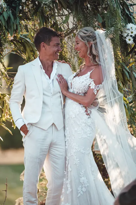 The couple laughing together after the ceremony