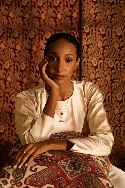Portrait of the model resting her cheek on her hand