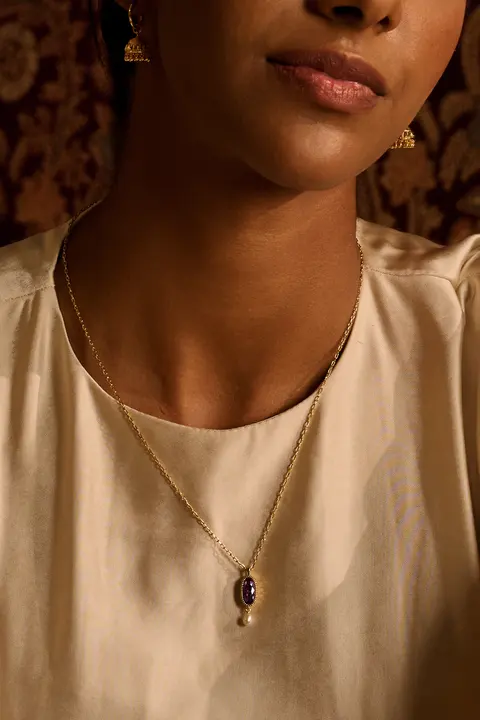 Portrait with a gold pendant resting on the chest