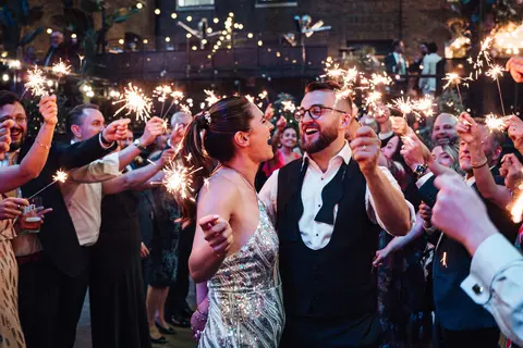 The bride dancing among sparklers