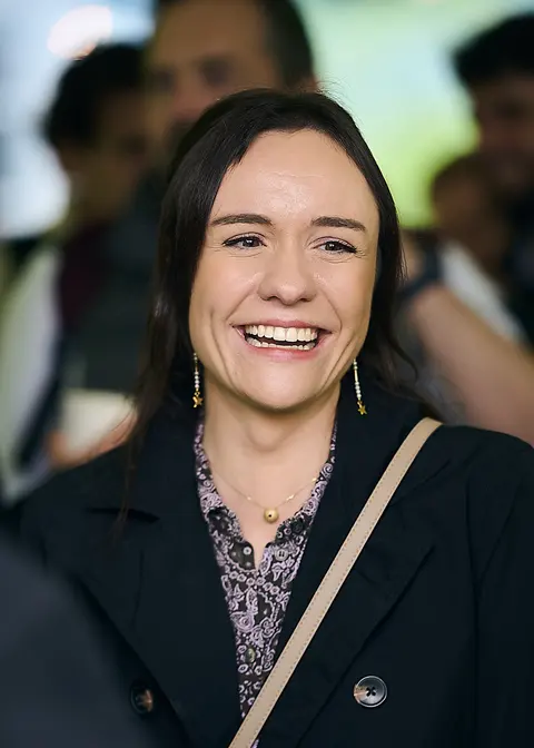 A guest laughing in the garden marquee