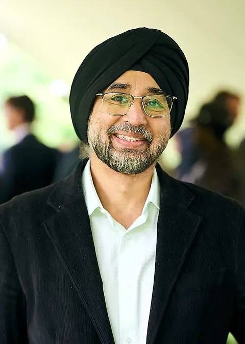 A guest in a black turban and glasses, portrait