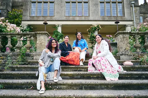 Guests sitting together on the stone garden steps