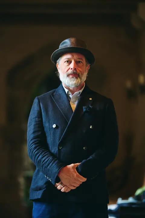 A guest in a flat cap, portrait
