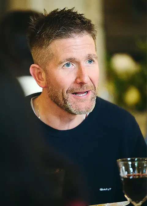 A guest in a navy fleece, candid profile