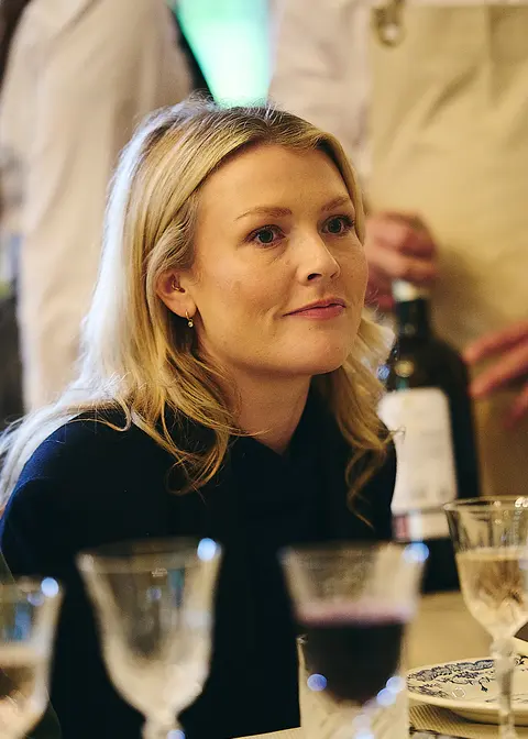 A guest talking candidly at the table