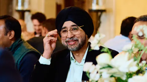 A guest in a turban, smiling portrait