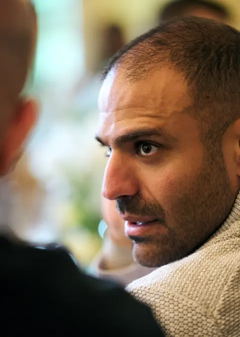 A bearded guest in a jumper, candid portrait