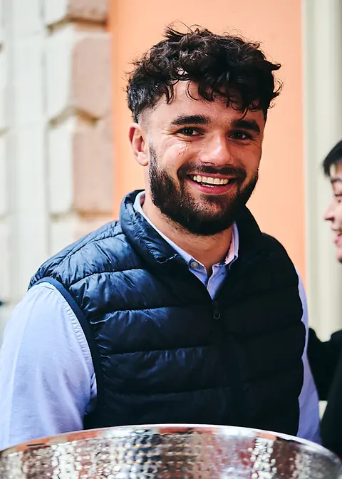 A guest laughing candidly