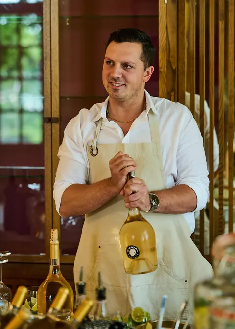 A chef arranging flowers on the lunch table