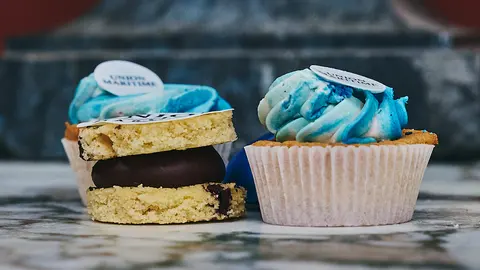 A close detail of a Union Maritime anniversary cupcake