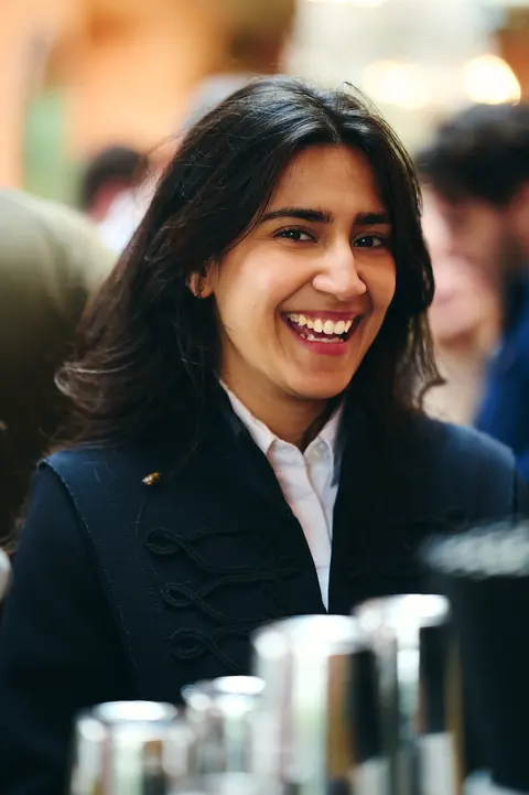 A guest smiling broadly at the reception