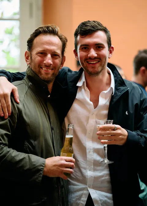 Two guests toasting each other with champagne